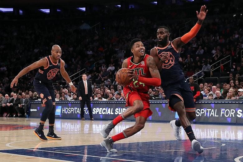Atlanta Hawks guard Kent Bazemore driving to the net against New York Knicks forward Tim Hardaway Jr during their 99-96 win at Madison Square Garden on Sunday. The Knicks, who are currently 11th out of 15 teams in the Eastern Conference, may be havin