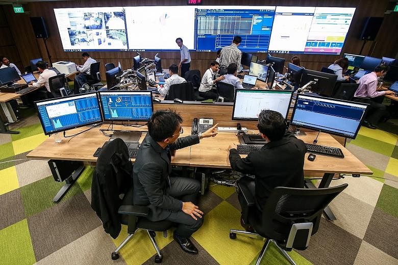 JTC's building managers and engineers monitor multiple properties from its J-Ops Command Centre in Jurong.
