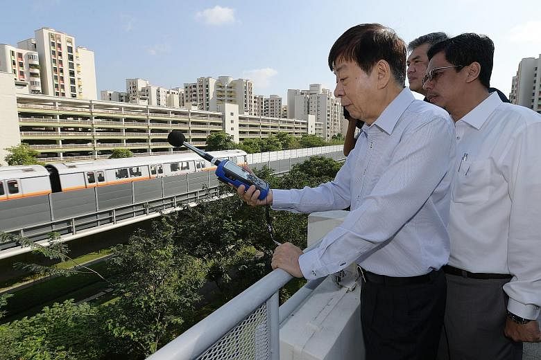 A noise meter showing the reading recorded at Sembawang Close yesterday as a train passed by. According to measurements taken at residential buildings, the noise barriers are able to reduce noise from passing trains by at least five decibels, the LTA