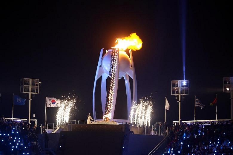 Winter Olympics: Lighting Olympic flame 'surreal', says skate queen Kim ...