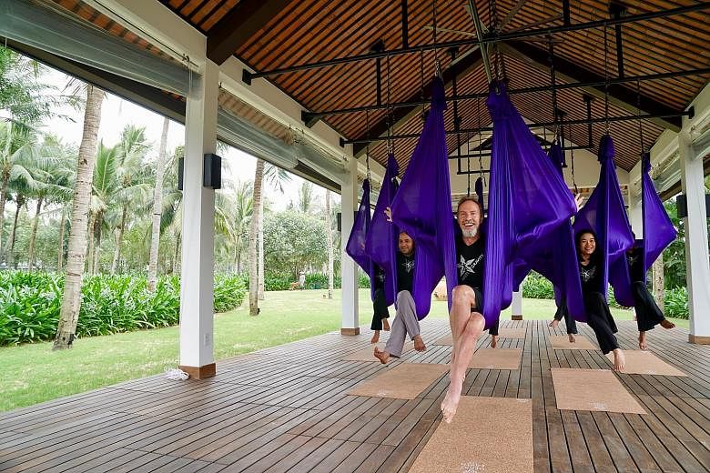 Four Seasons Resort The Nam Hai offers anti-gravity yoga sessions.