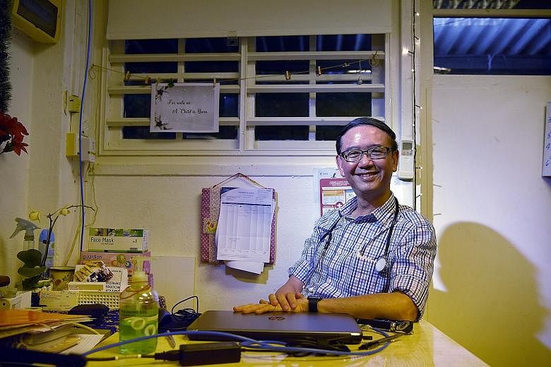 Above: Dr Goh Wei Leong in the HealthServe clinic in Lorong 23 Geylang. He co-founded the charity in 2006 with Mr Tang Shin Yong to help migrant workers. Left: Last Tuesday, Dr Goh and HealthServe won The Straits Times Singaporean Of The Year award.