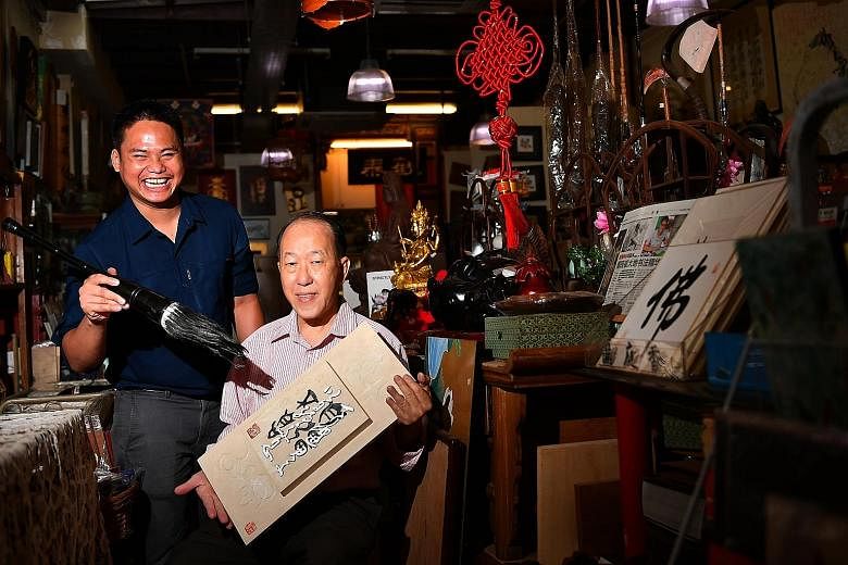 Acclaimed calligrapher Yong Cheong Thye (right) has been Mr Malik Mazlan's mentor for almost eight years.