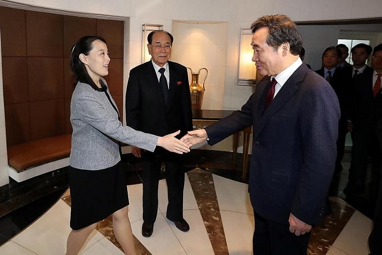 South Korean Prime Minister Lee Nak Yon greeting Ms Kim Yo Jong, the sister of North Korea's leader Kim Jong Un, and the North's ceremonial head of state Kim Yong Nam before a lunch yesterday.