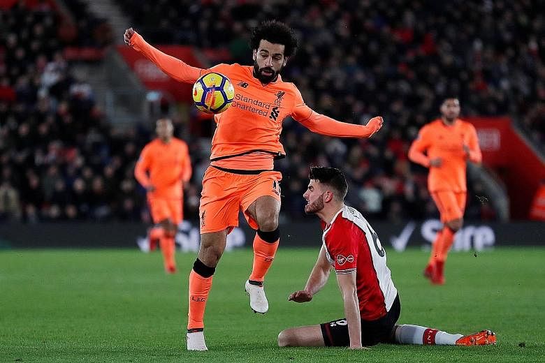 Liverpool's Mohamed Salah getting the better of Southampton defender Wesley Hoedt on Sunday. Salah pounced on an error by Hoedt to set up the opening goal before scoring his 22nd Premier League goal of the season.