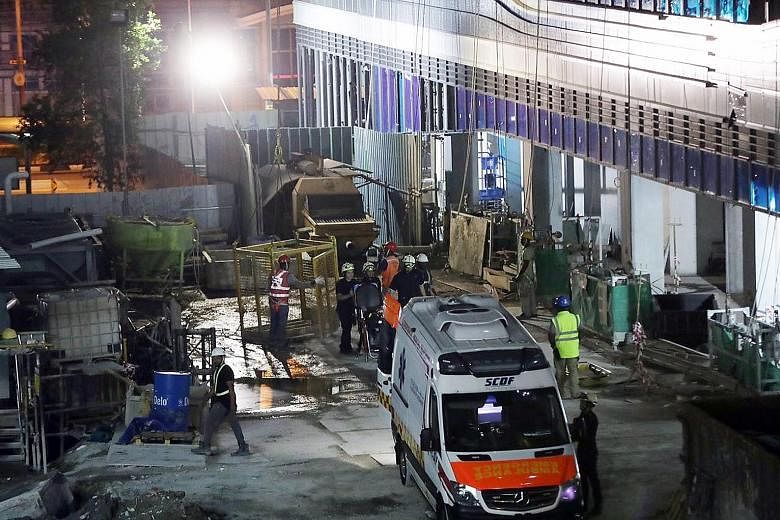 Singapore Civil Defence Force personnel at a Jalan Sultan worksite on Feb 5 following an accident in which a 41-year-old construction worker died after his neck was pierced by a reinforcing bar. Last year's drop in workplace deaths brings the fatalit