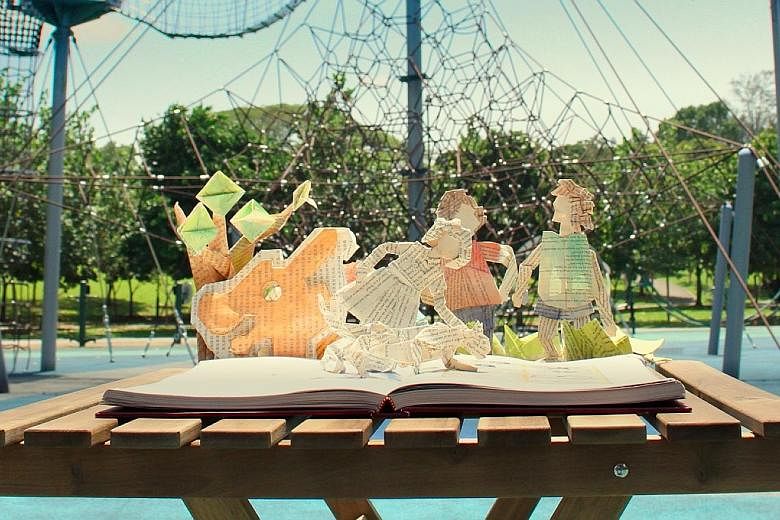 A film still from the #BuySingLit 2018 Read Our World trailer, which features stop-motion art using book pages.