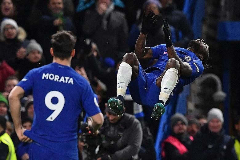 Left: Chelsea's Victor Moses doing a somersault as he celebrates scoring the second against West Brom at Stamford Bridge. Below: Chelsea coach Antonio Conte can afford a smile talking to fourth official Stuart Attwell, with the champions winning for 