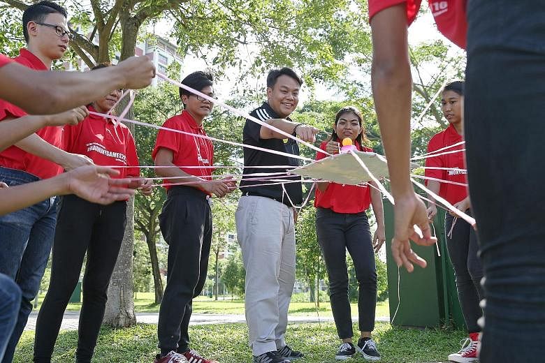Mr Delane Lim taking part in team-building activities with trainers of the HappYouth programme. Under this programme conducted by a charity he founded called the Character and Leadership Academy, students are trained to spot signs of depression in th