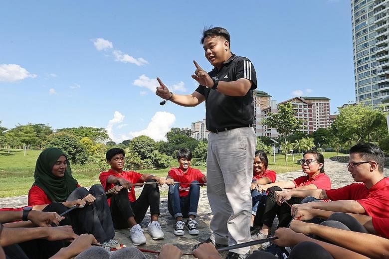 Mr Delane Lim taking part in team-building activities with trainers of the HappYouth programme. Under this programme conducted by a charity he founded called the Character and Leadership Academy, students are trained to spot signs of depression in th