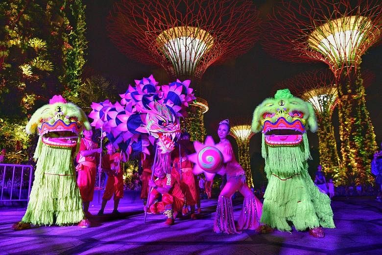 The traditional lion and dragon dance took on a modern twist at the Gardens by the Bay yesterday, as dancers pranced about the Supertree Grove aglow with ultraviolet light. The performance offered visitors a sneak peek of the "Rise of the Guardians" 