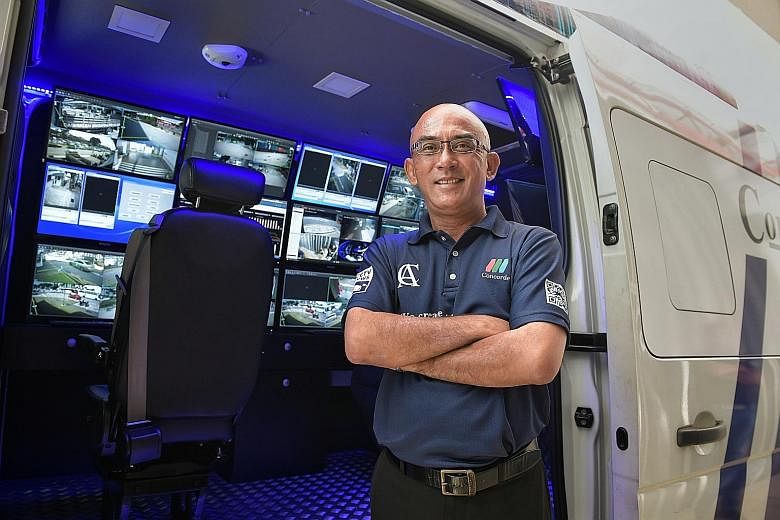 Senior security supervisor Eric Holmberg and two colleagues work from a roving command centre in a van that receives feeds from hundreds of closed-circuit TV cameras, allowing them to monitor large areas.