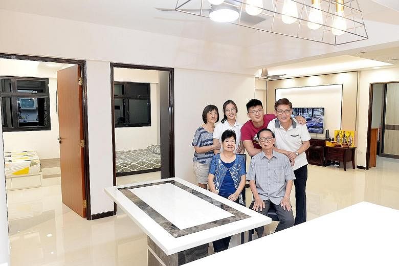 Mr Wong Khai Beng (standing, far right), 55, with his parents - Mr Wong Chong Hwee, 83, and Madam Lai Su Lan, 77, - his wife, Madam Ooi Guat Yian, 55, and their children - Rou Xuan (standing second from left), 19, and Jia Yi, 22 - in their new three-