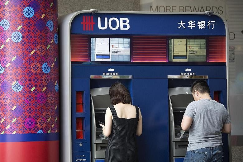 UOB's fourth-quarter net earnings rose 16 per cent to $855 million from a year ago.