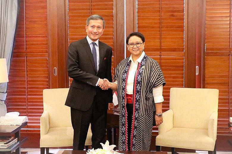 Foreign Minister Vivian Balakrishnan with his counterpart, Ms Retno Marsudi, during a two-day working visit to Indonesia.