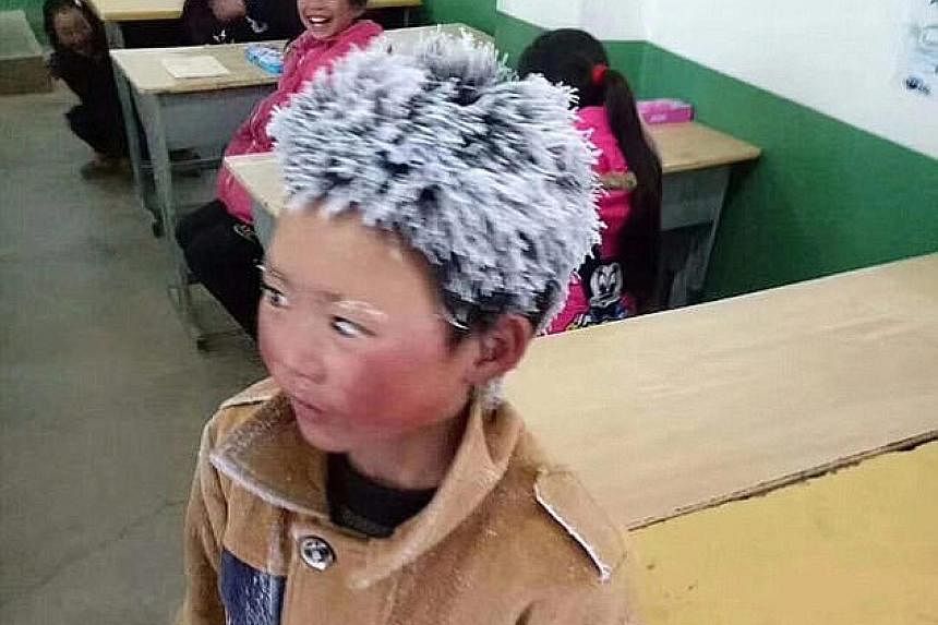 Far left: Wang Fuman with his hair and eyebrows encrusted with ice after a freezing, hour-long trek to school last month. Left: The eight-year-old is hoping for a Chinese New Year reunion with his mother, who walked out on her family two years ago.