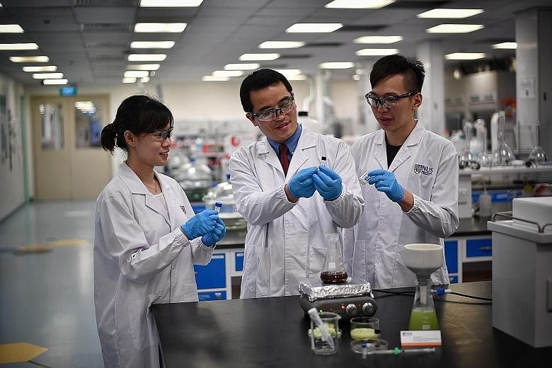 (From far left) PhD student Yu Xi, lead researcher Yang Hongshun and undergrad Matthew Yap are part of the team behind the new pesticide-screening technique.