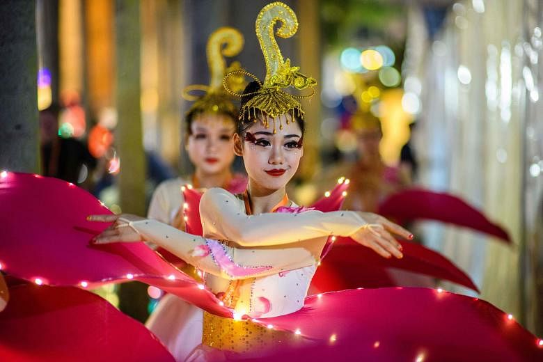 HONG KONG:Performers warming up for a street parade on the eve of the new year.