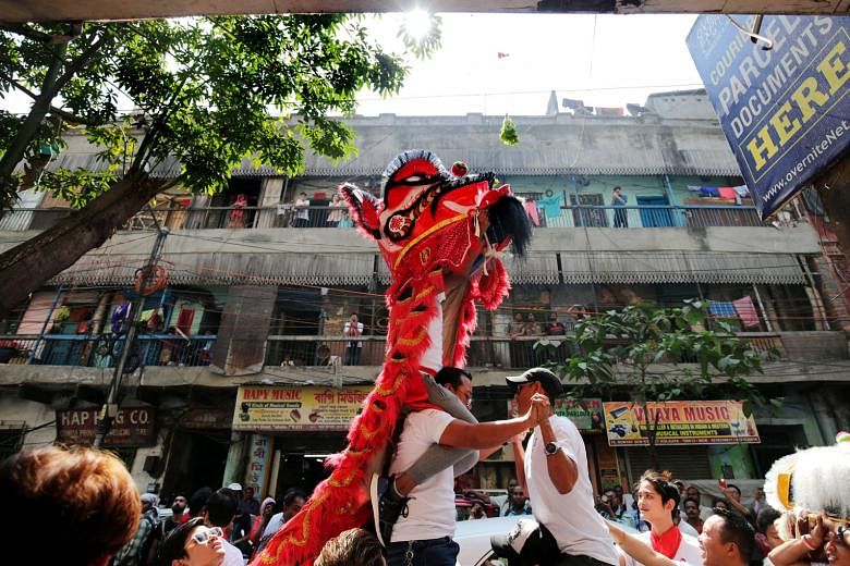 The Chinese community taking part in a lion dance during the Chinese New Year celebrations in Kolkata on Friday.
