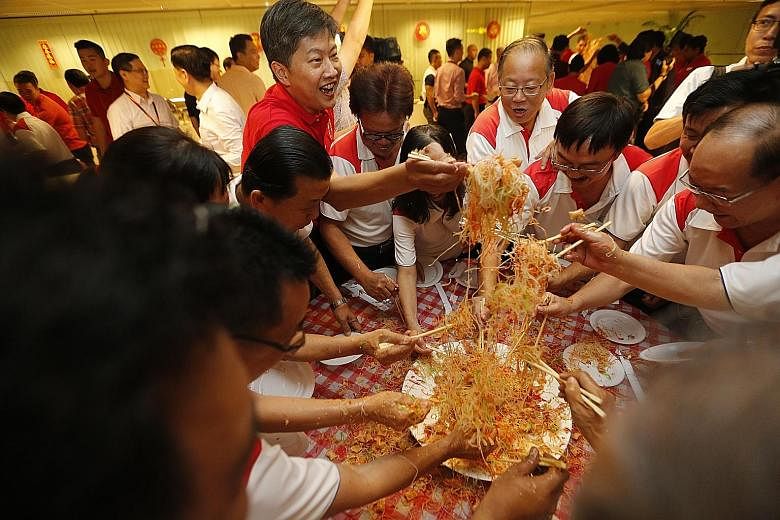 Over 90 members of three generations of the Thia extended family gathered at Amber Point condominium yesterday for their Chinese New Year celebration. Three large tables were used for their lo hei - the tossing of raw fish salad for good fortune. The