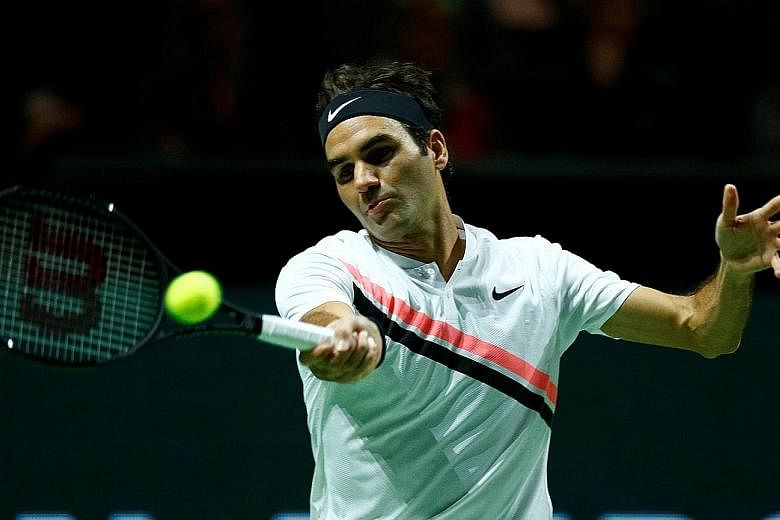 Roger Federer hitting a forehand en route to a 6-2, 6-2 victory over Bulgarian Grigor Dimitrov for his third Rotterdam Open title yesterday. He claimed his 97th career title in just 55 minutes, capping off a memorable week. The 36-year-old Swiss will