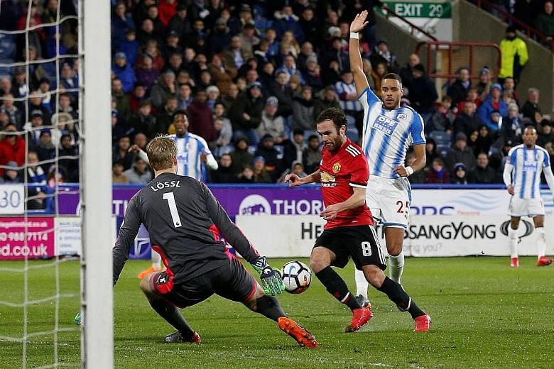 Juan Mata rounding Huddersfield goalkeeper Jonas Lossl before slotting home as defender Mathias Zanka appeals for offside. The call eventually went the way of the hosts but to little avail, as United ran out 2-0 winners in the FA Cup fifth-round tie 