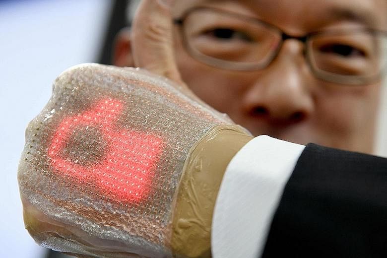 The device, developed by University of Tokyo's Professor Takao Someya, is only 1mm thick and can send and receive messages, including emojis. The plaster-like invention can be placed on the human body for a week without causing skin inflammation.