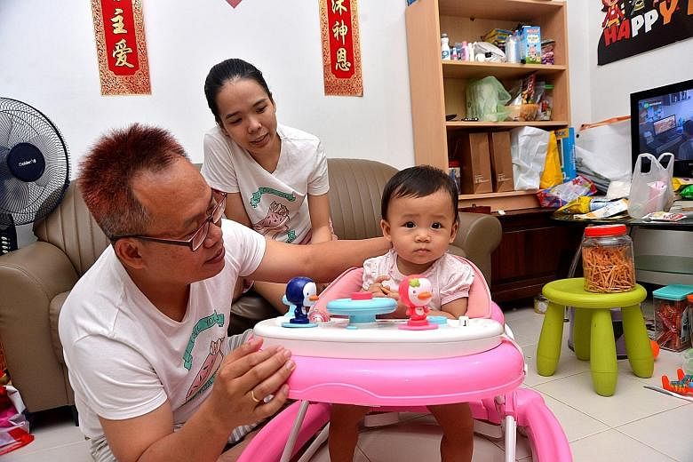 Mr Tony Teng, with wife Nguyen Thi Huyen Linh, 26, and one-year-old daughter Donna, is worried about his young family's growing expenses. Academics and experts noted that the lower-income groups will feel the pinch more from a GST increase.