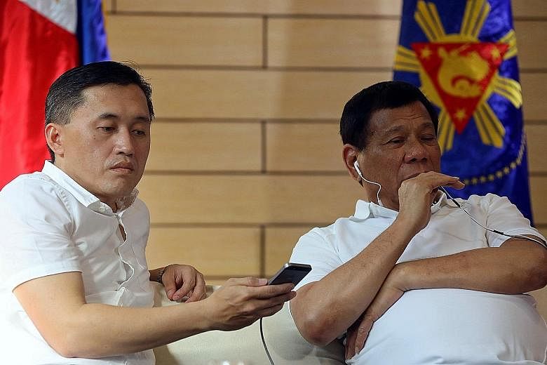 Philippine President Rodrigo Duterte with his special assistant Christopher Go in a photo taken last year. Mr Go has denied any wrongdoing in the procurement process for two frigates for the country's navy.