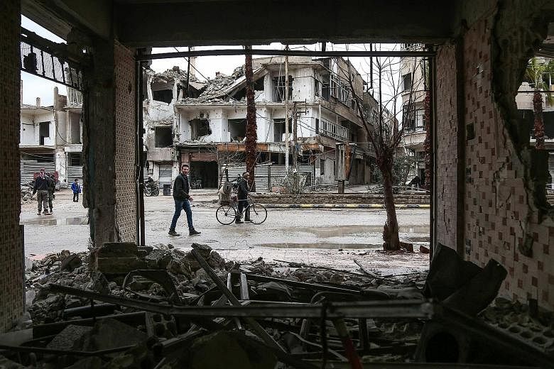 Destroyed buildings in Eastern Ghouta near Damascus last Saturday. Failing to reach a deal to evacuate a militant faction could signal the start of a ground assault.