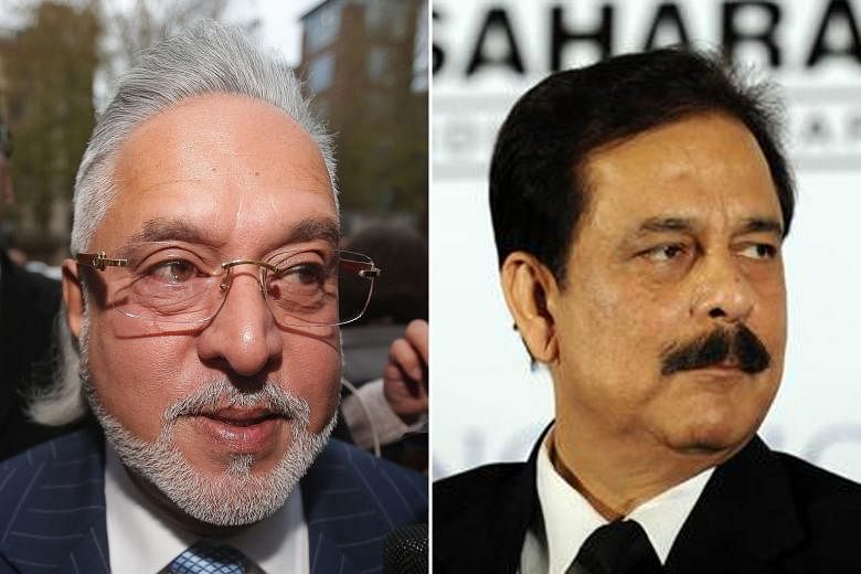 Vijay Mallya (left) is in London fighting extradition proceedings while Subrata Roy was jailed in 2014 over an illegal bond scheme.
