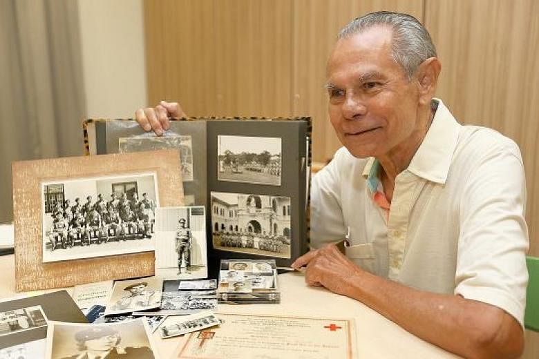 Mr Donald Wyatt, 82, showing documents and photos taken during the Occupation and after independence. His mother died in World War II and his father was tortured by the Japanese. He also experienced the 1969 race riots. Today, Mr Wyatt is a member of