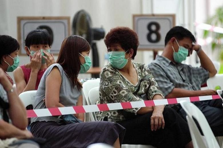 Patients waiting to be screened at Tan Tock Seng Hospital during the Sars outbreak in 2003. The purpose of the study by the School of Public Health was to discover public acceptance of different outbreak response policies.