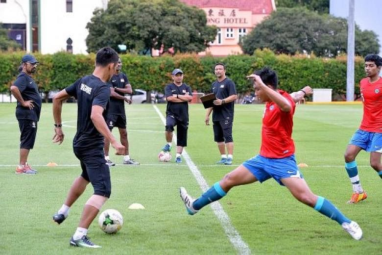Fandi Ahmad (third from right) at his first training session with the Young Lions. He revealed that 12 of the players admitted that they were smokers.