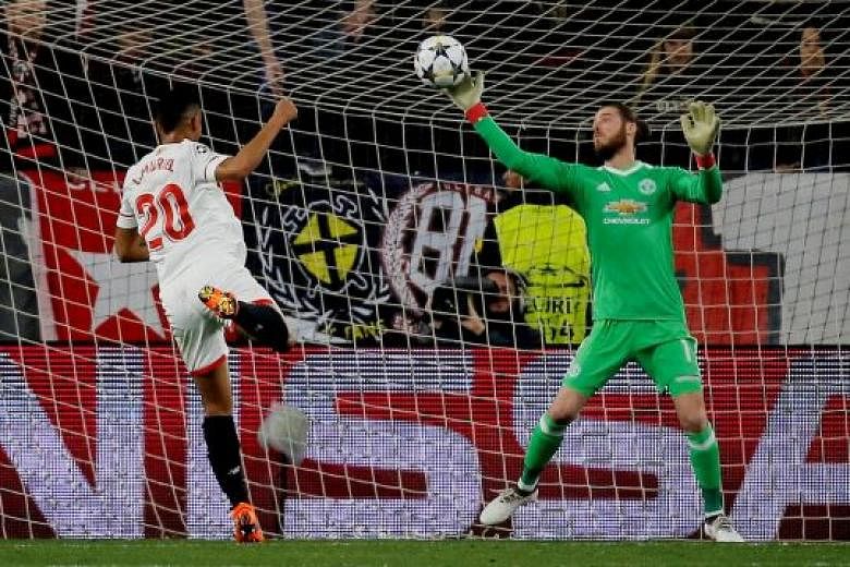 Manchester United's David de Gea pulling off a reflex, point-blank save from Sevilla's Luis Muriel in their 0-0 first-leg Champions League game in Seville on Wednesday. The hosts had 25 shots to United's six. 
