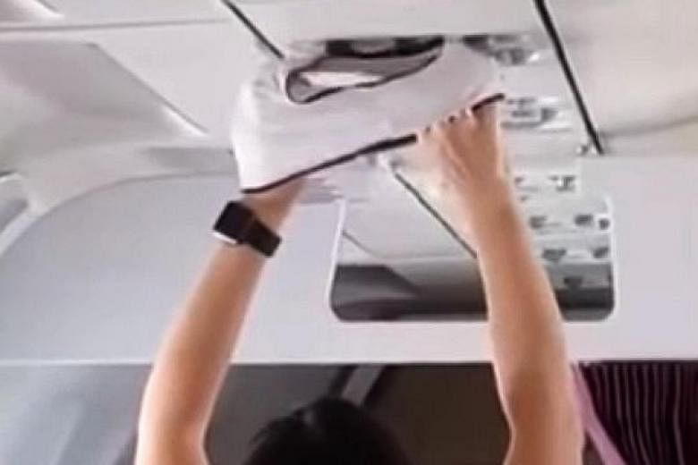 In a video that has been shared widely online, the woman is seen holding her underwear overhead while seated during her Moscow-bound flight. She moves it around just below the air vents, and even flips it a few times.