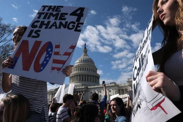 High school students rally against gun violence on Wednesday in front of the Capitol in Washington.
