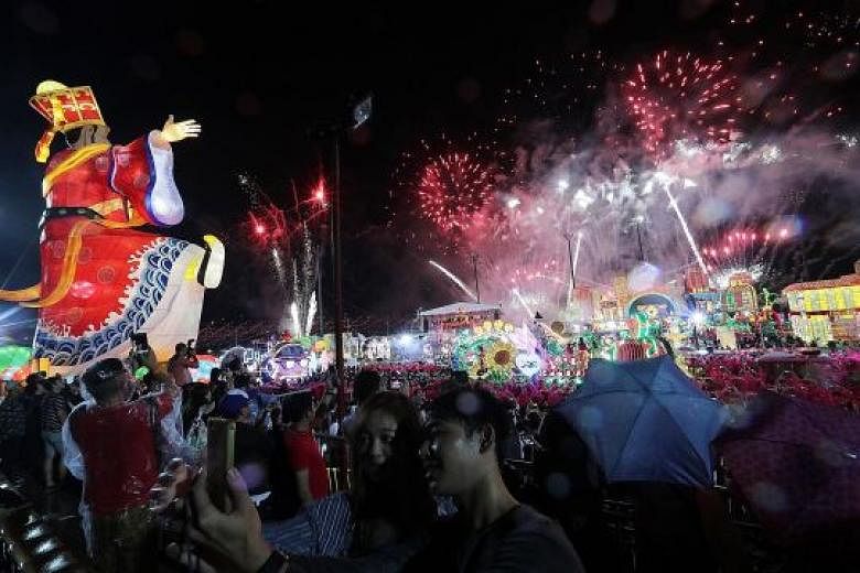 The crowd enjoying the fireworks display during the Chingay finale at River Hongbao last night. In an effort to step up security, the police robot was deployed after 8pm to patrol a 400m stretch at the end point of the parade.