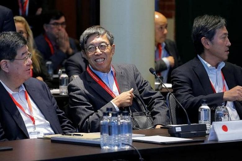Japan's chief trade negotiator, Mr Kazuyoshi Umemoto (centre), with other Japanese delegates at the TPP senior leaders meeting in Sydney last year. Japan's core plan had always been for TPP, and the Asia-Pacific, to include the US - until President D