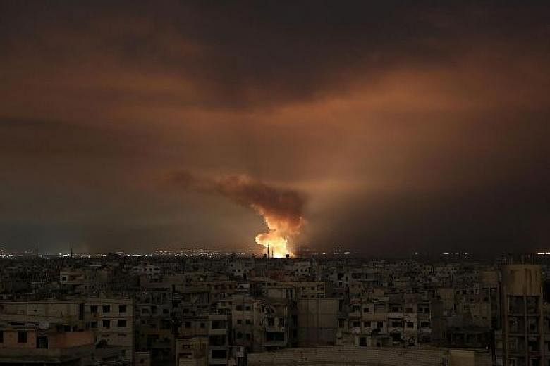 Smoke billowing from the site of an air strike in the besieged Eastern Ghouta region on the outskirts of the Syrian capital Damascus late on Friday. Syrian regime air strikes and artillery fire continue to rain down on the rebel-held enclave, where s