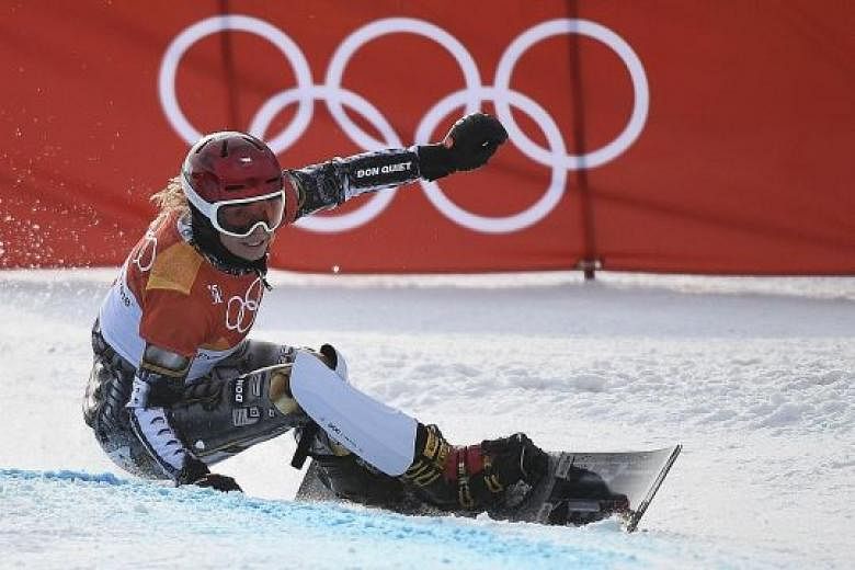 Ester Ledecka of the Czech Republic on her way to winning the women's snowboard parallel giant slalom yesterday. She also took gold in the skiing super-G last week.