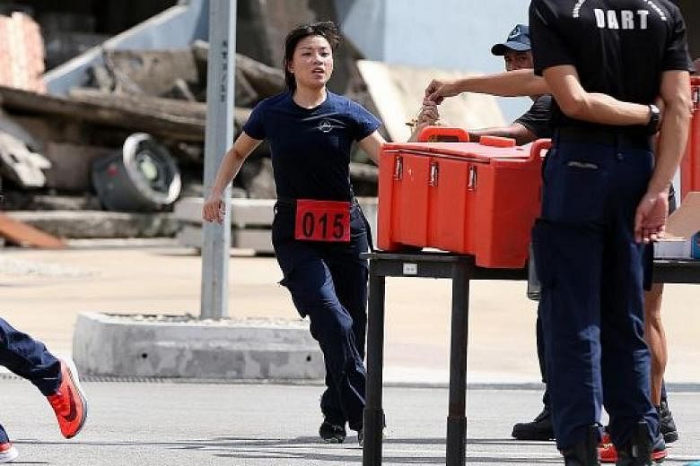 Lieutenant Gan Chea Hui in action during the SCDF's Disaster Assistance and Rescue Team selection this month.
