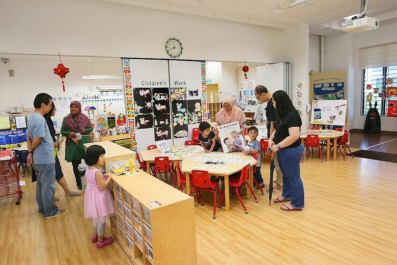 Parents and their children checking out the facilities during an open house at the MOE kindergarten situated within West Spring Primary School in Bukit Panjang Ring Road on Saturday.