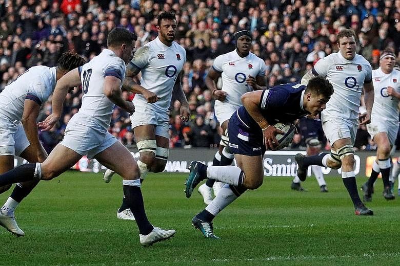 Huw Jones scoring Scotland's first try against England at Murrayfield Stadium on Saturday. The Scots' three tries in the first half were all the more remarkable as it was 14 years since they had last crossed England's try-line.