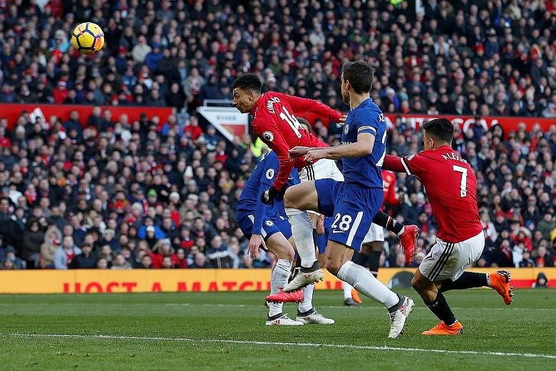 Manchester United substitute Jesse Lingard flings himself at a Romelu Lukaku cross to head in the winner in the 75th minute.