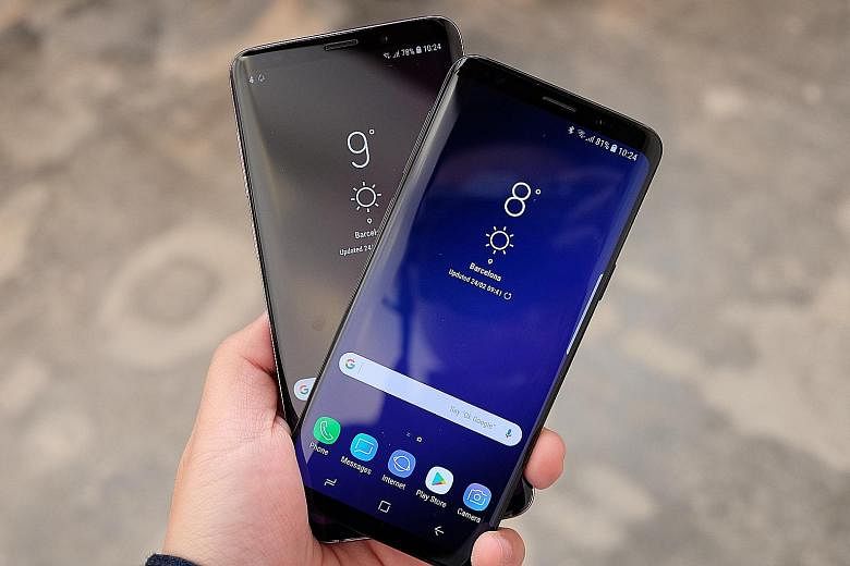 Samsung's Galaxy S9+ (far left) and S9 will be available in Singapore next month. Their prices have not yet been announced. WATCH THE VIDEO First looks at the Samsung Galaxy S9/S9+ phones http://str.sg/ o5WH