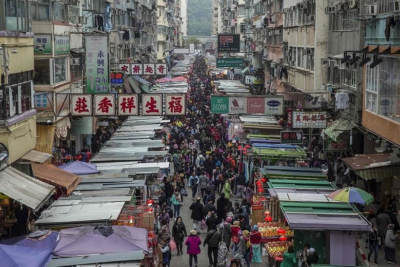 With Hong Kong (above) now comparable to New York in terms of income inequality, and amid persistent worries that its role as a financial centre is being eclipsed by the likes of Shenzhen or Shanghai, news of bumper fiscal takings is likely to prompt