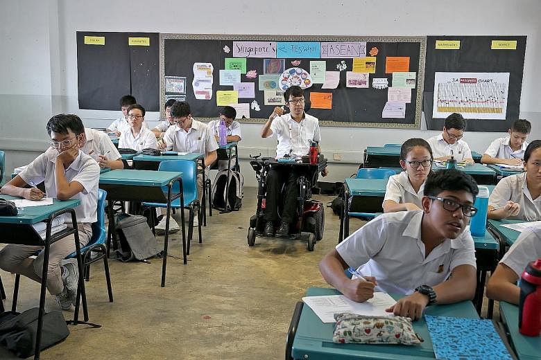 Mr Wong Zi Heng, 26, teaching a class at Bedok South Secondary School during a four-month teaching stint last year. He is currently pursuing a postgraduate diploma in education at the National Institute of Education.