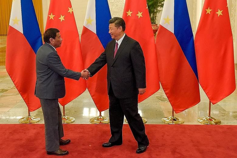 Philippine President Rodrigo Duterte (left) with Chinese President Xi Jinping at the Belt and Road Forum at the Great Hall of the People in Beijing last May. China has decided that the best way to assuage regional concerns about its geopolitical ambi