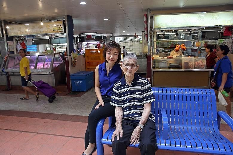 Ms Sandra Leong with her grandfather, Mr Chua Pee Tong. He enjoys going to the market but can do so only if he is accompanied, lest he falls. Ms Leong's idea was to have stalls form the inner core of hawker centres and wet markets and have an outer r